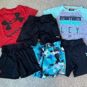 Lot of boys shirts and shorts.